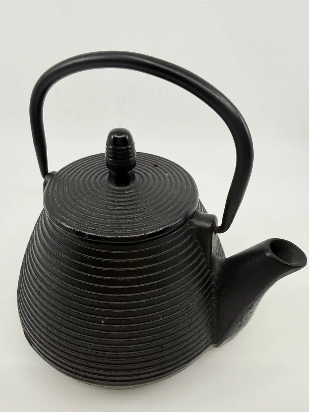 Elegant Black Cast Iron Teapot with Textured Finish
